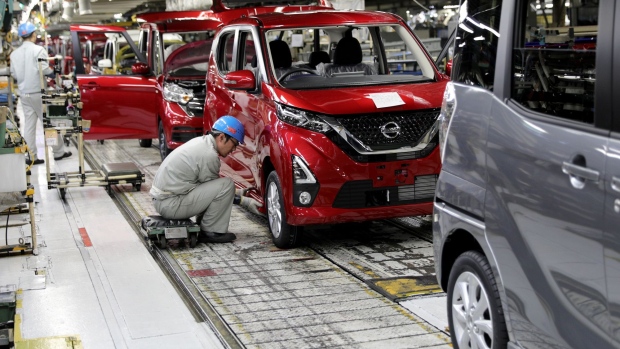 An employee works on the assembly line of the Nissan Motor Co. Dayz Highway Star vehicle at the Mitsubishi Motors Corp. Mizushima plant in Kurashiki, Okayama Prefecture, Japan, on Thursday, March 14, 2019. Nissan and Mitsubishi will jointly launch the new range of "Kei" cars with semi-autonomous driving technology.
