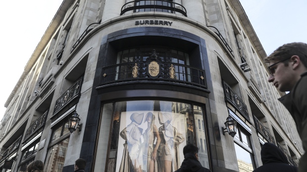 Pedestrians pass a Burberry Group Plc luxury fashion store in London, U.K., on Friday, Feb. 7, 2020. Burberry scrapped its financial guidance for the year, warning that the coronavirus epidemic is cutting sales by three-quarters or more at stores in China. Photographer: Simon Dawson/Bloomberg