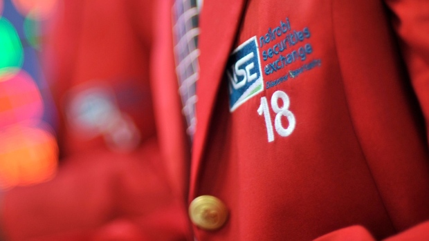 An embroidered NSE logo sits on the red jacket of an employee inside the Nairobi Securities Exchange Ltd. (NSE), in Nairobi, Kenya, on Tuesday, Dec. 8, 2015. The government had planned to plug the 2016-17 fiscal deficit with about 240 billion shillings of external borrowing, and about the same amount raised on the domestic debt market. Photographer: Bloomberg/Bloomberg