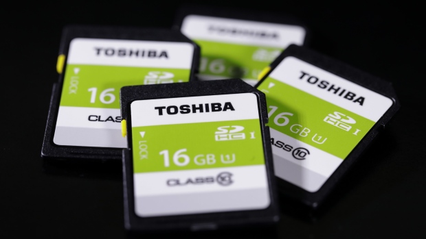 Toshiba Corp. secure digital high capacity (SDHC) memory cards are arranged for a photograph in Tokyo, Japan, on Thursday, Aug. 17, 2017. Under pressure from its banks, Toshiba is racing to resolve several final disagreements with Western Digital Corp. before it can complete a deal to sell its chips business to the U.S. company and other investors by the end of August, according to people familiar with the matter. Photographer: Kiyoshi Ota/Bloomberg