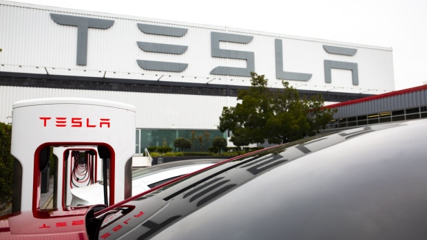 Tesla Inc. electric vehicles charge at the Tesla Supercharger station in Fremont, California, U.S., on Monday, July 20, 2020. Tesla Inc. is scheduled to release earnings figures on July 22. Photographer: Nina Riggio/Bloomberg