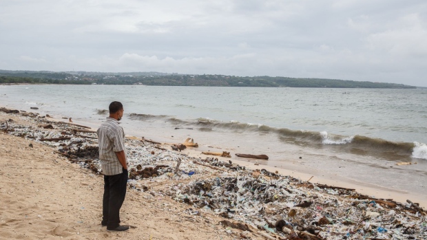 Plastic debris and other trash is washed up on Kedonganan beach in Bali, Indonesia, on Friday, Jan. 22, 2021. Movement restrictions in Bali were extended by two weeks to Feb. 8 as the government sought to curb the spread of coronavirus infections. Photographer: Putu Sayoga/Bloomberg