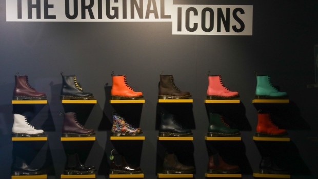 Shoes on display inside the Dr. Martens store on Carnaby Street in London, U.K., on Wednesday, Jan. 20, 2021. Bootmaker Dr. Martens, known for its air-cushioned soles, is considering an equity value of 4 billion pounds ($5.4 billion) or more in an initial public offering.