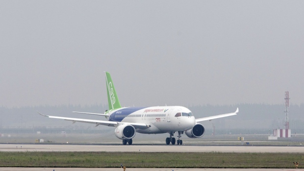 A Commercial Aircraft Corp. of China Ltd. (Comac) C919 aircraft taxis after landing at the Pudong International Airport in Shanghai, China, on Friday, May 5, 2017. China's first modern passenger jet completed its maiden test flight, giving wings to President Xi Jinping's ambition of turning China into an advanced economy.