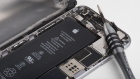 A lithium-ion battery is seen inside the rear case of an Apple Inc. iPhone 6 smartphone in an arranged photograph in Bangkok, Thailand, on Friday, Feb. 2, 2018. Apple Chief Executive Officer Tim Cook told shareholders on Feb. 13 at the company's annual meeting to expect higher dividends and stressed that succession planning is a priority.