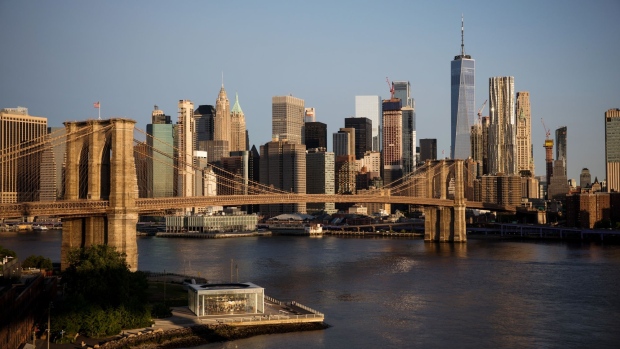 The Brooklyn Bridge stands in front of the lower Manhattan skyline in New York, U.S., on Wednesday, May 22, 2019. Stocks slumped globally on Thursday and traders took refuge in gold and bonds as the simmering trade dispute between the world's two largest economies took a greater toll on markets. Photographer: Michael Nagle/Bloomberg