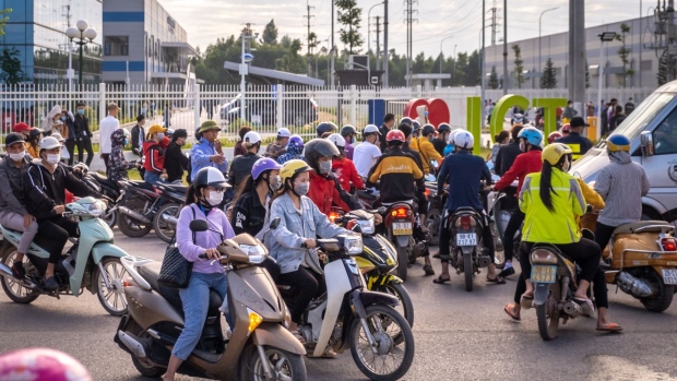 Morning commuters make their way to work at the Van Trung Industrial Park in Viet Yen district, Bac Giang province, Vietnam.