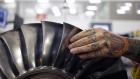 An employee handles a turbine at the General Electric Co. (GE) Aviation assembly plant in Lafayette, Indiana, U.S., on Friday, July 19, 2019. General Electric is scheduled to release earnings figures on July 31.