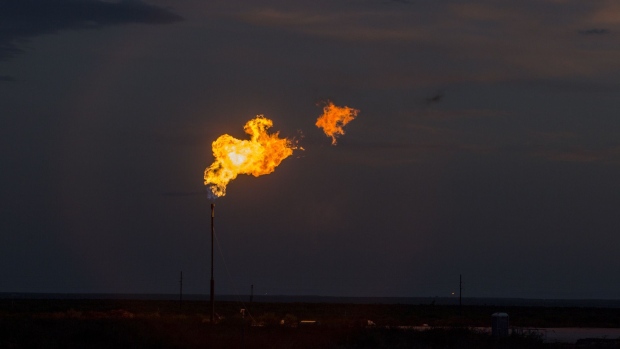 A gas flare is seen in a field at dusk near Mentone, Texas, U.S., on Saturday, Aug. 31, 2019. Natural gas futures headed for the longest streak of declines in more than seven years as U.S. shale production outruns demand and inflates stockpiles. Photographer: Bronte Wittpenn/Bloomberg