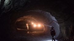 A worker shines a light on a truck transferring silver bearing ore to a hopper at the Negociacion Minera Santa Maria de la Paz y Anexas SA silver mine in the town of Villa de La Pas, Matehuala, San Luis Potosi State, Mexico, on Wednesday, April 4, 2018. The National Institute of Statistics and Geography (INEGI) is scheduled to release mining figures on April 30. Photographer: Mauricio Palos/Bloomberg