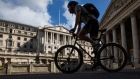 A cyclist passes the Bank of England (BOE) in City of London, U.K., on Tuesday, Aug. 4, 2020. Bank of England officials could signal on Thursday that the case for more monetary stimulus is growing as a nascent rebound from the pandemic-induced recession risks fading. Photographer: Simon Dawson/Bloomberg