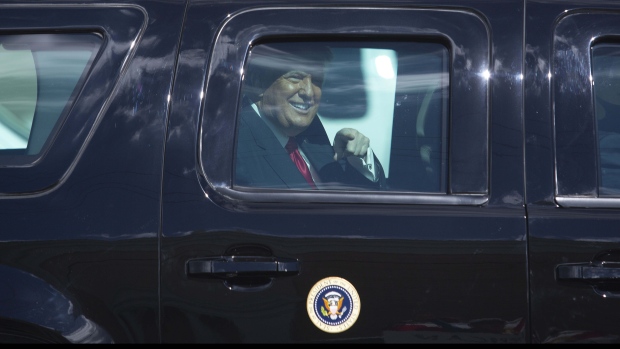 U.S. President Donald Trump waves to supporters as he arrives at Mar-A-Lago in Palm Beach, Florida, U.S., on Wednesday, Jan. 20, 2021. Trump departs Washington with Americans more politically divided and more likely to be out of work than when he arrived, while awaiting trial for his second impeachment - an ignominious end to one of the most turbulent presidencies in American history.