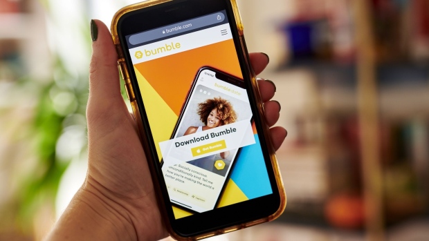 The website home screen for Bumble is displayed on a smartphone in an arranged photograph taken in the Brooklyn borough of New York, U.S., on Friday, Oct. 9, 2020. Blackstone Group, which bought a majority stake in the owner of dating app Bumble last year when it was known as MagicLab, is now seeking a payout from a $200 million loan. Photographer: Gabby Jones/Bloomberg