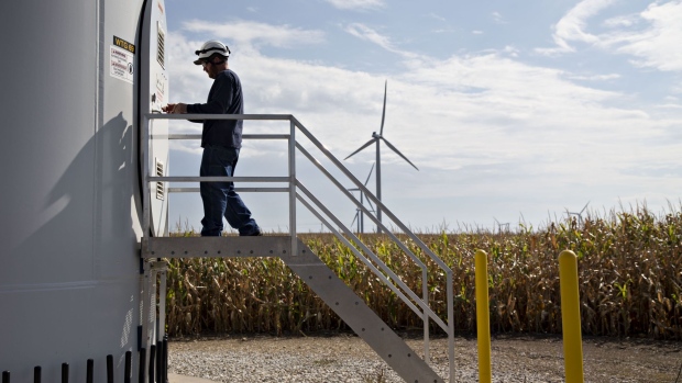 A technician enters a wind turbine on property used by the Alliant Energy Corp. Whispering Willow Wind Farm in Iowa Falls, Iowa, U.S., on Thursday, Sept. 15, 2016. Wind energy, the fastest-growing source of electricity in the U.S., is transforming low-income rural areas in ways not seen since the federal government gave land to homesteaders 150 years ago.