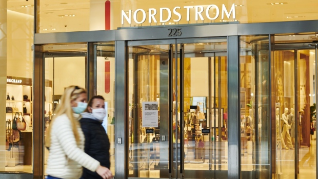Pedestrians pass in front of a Nordstrom Inc. store in the Midtown neighborhood of New York, U.S., on Friday, March 20, 2020. Some retail segments, such as grocery chains and Walmart, may benefit from the coronavirus outbreak. But for a sector already battered by the shift to online retailing and other structural changes, the coronavirus only portends more pain. Photographer: Gabby Jones/Bloomberg