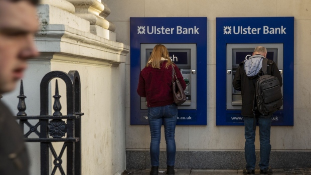 Customers uses Automated Teller Machines (ATMs) at a branch of Ulster Bank, a unit of the Royal Bank of Scotland Group Plc (RBS), in Belfast, Northern Ireland, U.K., on Friday, Jan. 3, 2020. Brexit may have blurred the lines between political tribes in the U.K., but in Northern Ireland it's entrenched them even more.