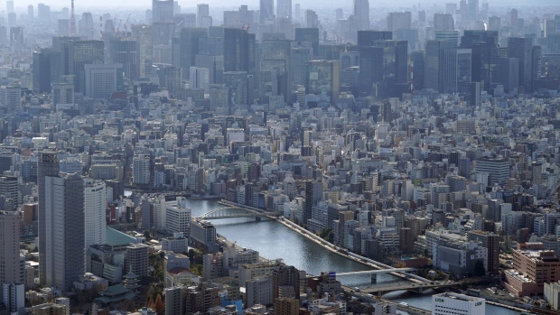 The Sumida River flows through Tokyo, Japan, on Friday, Dec. 25, 2020. Japan's infrastructure is already one of the world’s safest and investment in mitigating natural disasters is ramping up. Photographer: Toru Hanai/Bloomberg