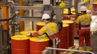 An employee caps oil drums containing lubricant oil at the Royal Dutch Shell Plc lubricants blending plant in Torzhok, Russia, on Wednesday, Feb. 7, 2018. The oil-price rally worked both ways for Royal Dutch Shell Plc as improved exploration and production lifted profit to a three-year high while refining and trading fell short of expectations as margins shrank.