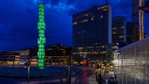 Sculpture Crystal, vertical accent in glass and steel, stands illuminated green in Sergel Square in Stockholm, Sweden, on Monday, May 6, 2019. Electricity capacity issues could hit an economy already heading south after years of strong growth buoyed by household spending and exports.