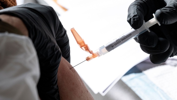 A healthcare worker administers a dose of the Moderna Covid-19 vaccine at a walk up vaccination site in San Francisco, California, U.S., on Wednesday, Feb. 3, 2021. San Francisco opened its first neighborhood coronavirus vaccination site in the Mission District on Monday, with plans to open a second in the Bayview in the coming days, reported the San Francisco Chronicle.