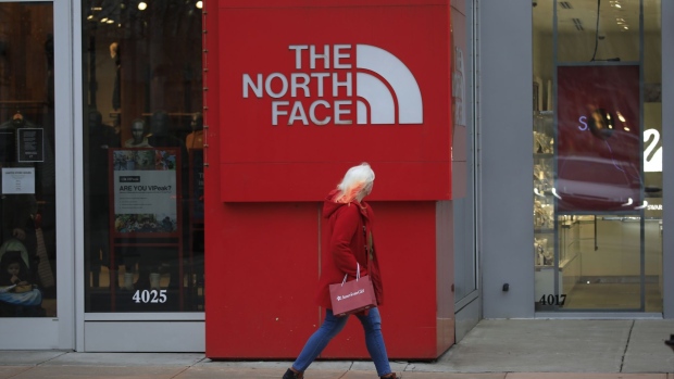A shopper passes in front of a North Face Inc. store at the Easton Town Center Mall in Columbus, Ohio, U.S., on Thursday, Jan. 7, 2021. The U.S. Census Bureau is scheduled to release retail sales figures on January 15.