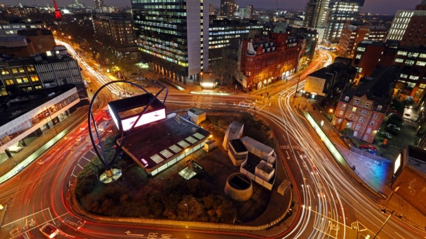 Bloomberg Photo Service 'Best of the Week': Light trails from traffic are seen as they pass around the Old Street roundabout, in the area known as London's Tech City, in London, U.K.