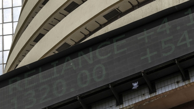 An electronic ticker board indicates stock figures for Reliance Industries Ltd. at the Bombay Stock Exchange (BSE) building in Mumbai, India, on Monday, May 20, 2019. Indian stocks rallied the most in more than three years and the rupee and sovereign bonds climbed after exit polls signaled Prime Minister Narendra Modi’s ruling coalition is poised to retain power. Photographer: Dhiraj Singh/Bloomberg