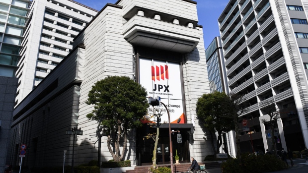 A cyclist travels past the Tokyo Stock Exchange (TSE), operated by Japan Exchange Group Inc. (JPX), in Tokyo, Japan, on Monday, Jan. 4, 2021. Asian stocks climbed to a new record, as technology shares remained strong in the first session of 2021.
