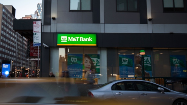 Vehicles drive past an M&T Bank branch in New York, U.S., on Saturday, Jan. 13, 2018. M&T Bank Corp. is scheduled to release earnings figures on January 18.
