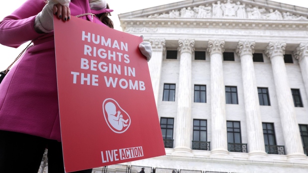 A pro-life activist holds a sign outside the U.S. Supreme Court during the 48th annual March for Life January 29, 2021 in Washington, D.C. 