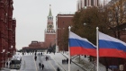 Two Russian Federation flags fly on a road leading to the Lenin mausoleum on Red Square in Moscow, Russia, on Thursday, Nov. 10, 2016. Russia is realistic about limits on the prospects for an immediate improvement in relations with the U.S. after President-elect Donald Trump takes office, according to President Vladimir Putin’s spokesman. Photographer: Andrey Rudakov/Bloomberg