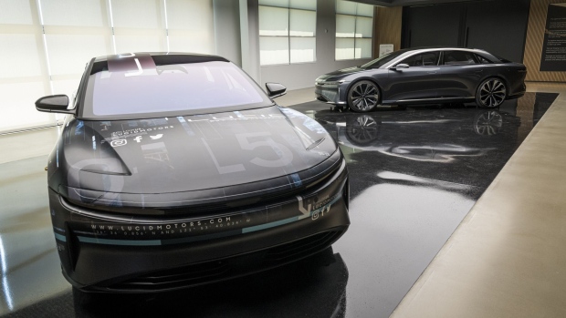 Peter Rawlinson next to a Lucid Air at the company's headquarters in Newark, California, on Aug. 3, 2020.