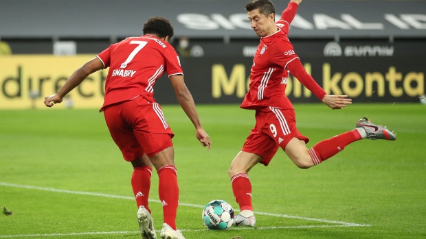 Robert Lewandowski tries to score during a match between Borussia Dortmund and FC Bayern Muenchen in Dortmund, Germany.in 2020.