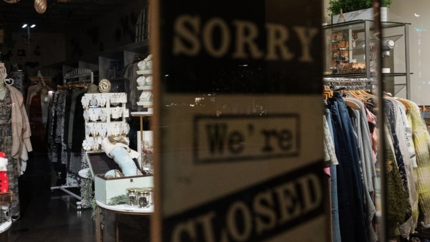 A "Sorry We're Closed" sign inside a clothing store at the Del Mar Highlands Town Center outdoor mall in San Diego, California.