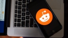 Reddit Inc. logo on a smartphone arranged in Hastings-On-Hudson, New York, U.S., on Friday, Jan. 29, 2021. Reddit Inc. Chief Executive Officer Steve Huffman said on Thursday that the WallStreetBets forum is “by no means perfect but they’ve been well in the bounds of our content policy.”