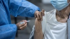 A healthcare worker administers a dose of the AstraZeneca Covid-19 vaccine at a vaccination center at La Rural convention center in Buenos Aires, Argentina, on Monday, Feb. 22, 2021. 