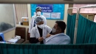 Healthcare workers administer a dose of Bharat Biotech Ltd. Covaxin vaccine for coronavirus at Sanjeevan Hospital in Daryaganj, New Delhi, India, on Thursday, Feb. 11, 2021. India is the second-worst virus-hit country in the world, trailing only the U.S. with more than 10.9 million infections. Photographer. T. Narayan/Bloomberg