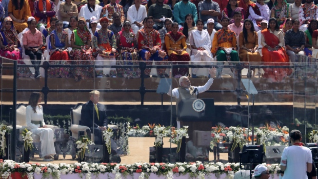Photographers and television camera operators work during the 'Namaste Trump' event at the Motra Stadium in Ahmedabad, India, on Monday, Feb. 24, 2020. The U.S. will sign military deals worth more than $3 billion with India on Tuesday, President Donald Trump said at the start of a two-day state visit to the South Asian nation.