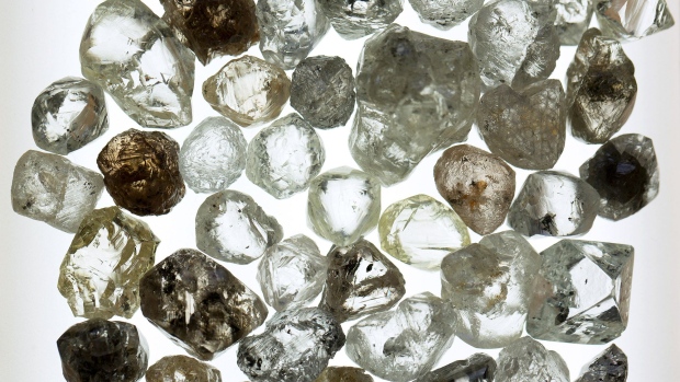 A collection of rough diamonds sit on a lightbox during sorting at the United Selling Organisation (USO) of Alrosa PJSC sorting center in Moscow, Russia, on Tuesday, Feb. 12, 2019. Alrosa PJSC, one of the world’s top diamond miners, is returning to crisis-stricken Zimbabwe, the latest example of Russia expanding its footprint in Africa.