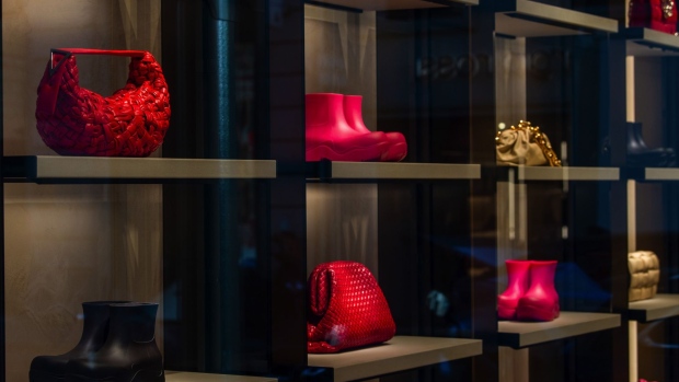Boots and handbags in a Bottega Veneta luxury goods store in Paris.
