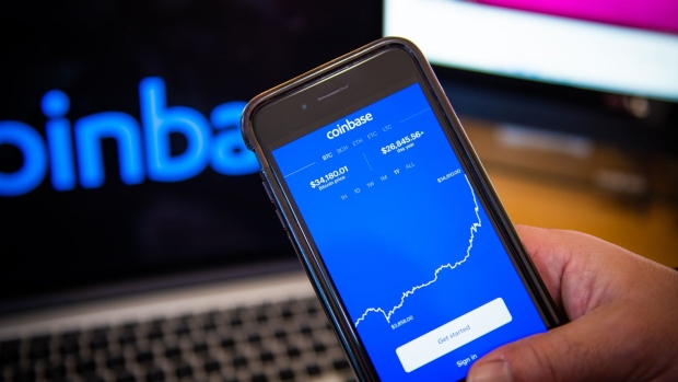 The Coinbase application on a smartphone arranged in Hastings-on-Hudson, New York, U.S., on Monday, Jan. 4, 2021. Coinbase Inc. knew cryptocurrency XRP was a security rather than a commodity and "illegally" sold Ripple Labs Inc.'s tokens anyway, a customer argues in a proposed class-action lawsuit over the commissions the crypto exchange collected.