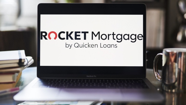 Signage for Rocket Mortgage by Quicken Loans is displayed on a laptop computer in an arranged photograph taken in the Brooklyn borough of New York, U.S., on Thursday, Aug. 6, 2020. Shares in Rocket Companies Inc., the parent of the mortgage giant founded by billionaire Dan Gilbert, gained 2.6% in early trading after a shrunken initial public offering that raised $1.8 billion. Photographer: Gabby Jones/Bloomberg