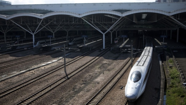 A China Railway High-speed (CRH) train, operated by China Railway Corp., leaves Shenzhen North Railway Station in Shenzhen, China, on Sunday, Sept. 23, 2018. The world's longest high-speed rail network extended to downtown Hong Kong today, providing a direct connection to 44 mainland destinations. Photographer: Giulia Marchi/Bloomberg