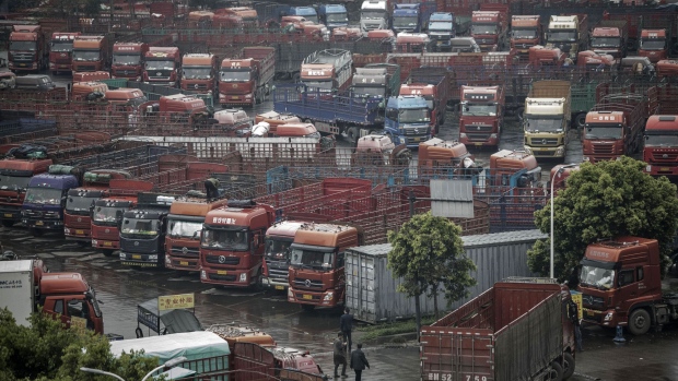 Trucks sit idle in a parking lot at a logistics park in Chengdu, China, on Tuesday, April 11, 2017. Photographer: Qilai Shen/Bloomberg