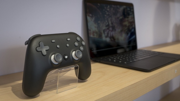 Phil Harrison holds a Stadia controller during the Game Developers Conference in 2019. Photographer: David Paul Morris/Bloomberg