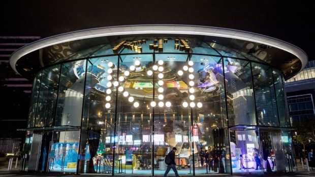An entrance to the K11 Musea shopping mall, developed by K11 Group Ltd., a unit of New world Development Co., stands illuminated at night in Tsim Sha Tsui district of Hong Kong, China, on Sunday, Dec. 15, 2019. The K11 Musea opened amid months of anti-Beijing protests held back spending by tourists and locals alike. Photographer: Paul Yeung/Bloomberg