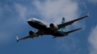 A Boeing Co. 737 Max 7 jetliner flies during the flying display on the opening day of the Farnborough International Airshow (FIA) 2018 in Farnborough, U.K.,