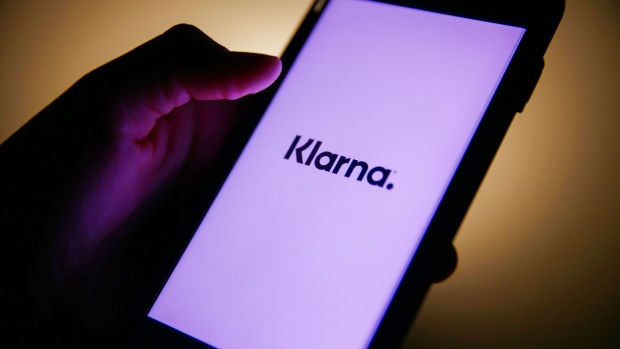 A Klarna logo on a mobile phone arranged in London, U.K., on Thursday, Jan. 21, 2021. Klarna AB, a Swedish payment provider for online shoppers, is still setting its sights on an initial public offering even after its latest funding round left it roughly twice as valuable as it was a year ago.