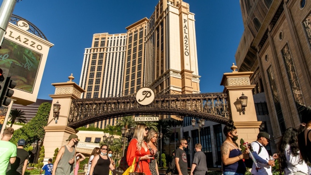 Pedestrians pass in front of the Venetian Resort in Las Vegas, Nevada, U.S., on Sunday, Oct. 18, 2020. Las Vegas Sands Corp. is scheduled to release earnings figures on October 21.