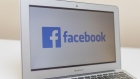 The Facebook Inc. logo is displayed on an Apple Inc. Macbook Air laptop in an arranged photograph taken in New York, U.S., on Thursday, July 26, 2018. Facebook shares plunged 19 percent Thursday after second-quarter sales and user growth missed Wall Street estimates.